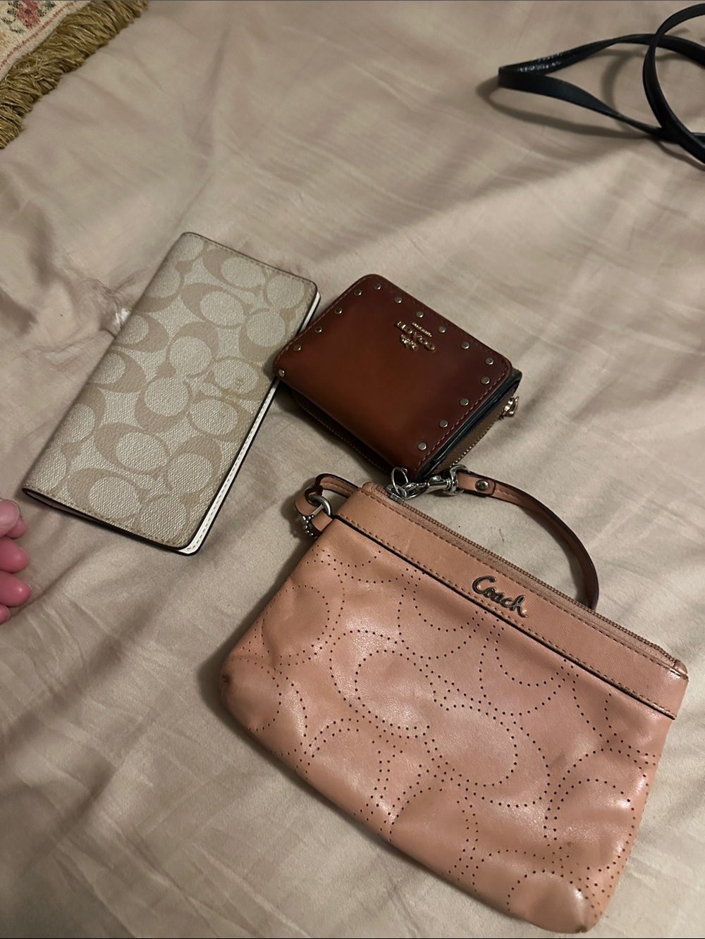 Coach Perforated Signature Wristlet in Blush Pink